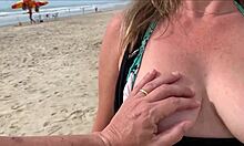 I'm cumming right in front of everyone at the beach again. People are staring while I blow this huge cock with my tits out!