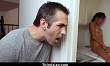 Cute Asian babe caught playing with huge dildo