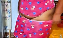 Chubby Woman Applies Moisturizer Naked In Lingerie Outdoors.