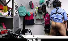 Loss prevention officer intensely checks teen 18+ for hidden items.