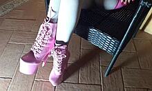 Latina milf sits on chair in pantyhose and high heeled boots, looking sexy