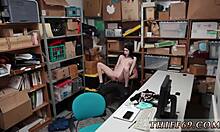 police officer deals with a caught suspect in the store, involving a woman