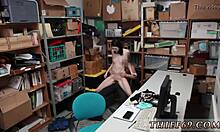 police officer deals with a caught suspect in the store, involving a woman