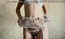 Amateur redhead poses seductively in white lingerie