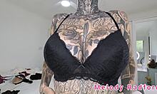 Melody Radford tries on black and purple lingerie and micro bikini in her haul.