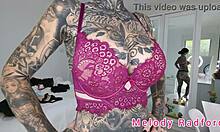 Melody Radford tries on black and purple lingerie and micro bikini in her haul.