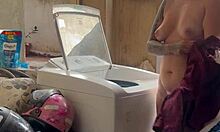 neighbor watches woman wash clothes outdoors freely