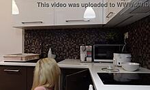 Hot blonde petite 18+ girlfriend skips panties under short miniskirt to flash tight shaved pussy and naked ass in kitchen