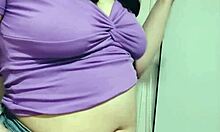 Nicole's teasing with her saggy tits before stuffing her stomach – intriguing contrast.