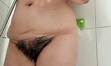 Stepmom relaxes in bath after intense hardcore fucking session with natural tits exposed.