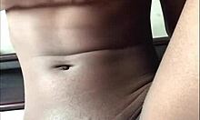 Petite Ebony Woman Relaxing Alone in the Bedroom