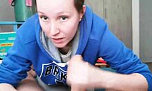 Brunette in hoodie sucking huge cock