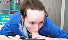 Brunette in hoodie sucking huge cock