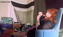 Sexy red-headed transsexual swallows 8-inch vibrating dildo