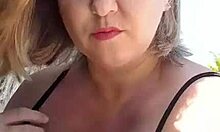 African milf shows off big tits and pussy lips on the beach