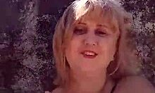 African milf shows off big tits and pussy lips on the beach