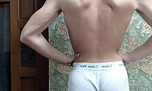 flex skinny boy in underwear showing off muscular bodybuilder moves