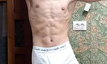 flex skinny boy in underwear showing off muscular bodybuilder moves