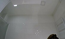 Brunette shows panties under mini skirt in bathroom