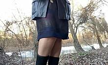 This mature busty milf pisses outdoors in stockings and dress!