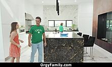 stepdaughter helps her father-in-law in the kitchen while stepmom is busy