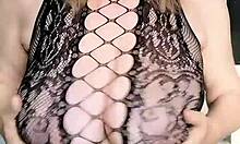 sexy black milf in net dress and heels shows off huge tits and shaved pussy close-up