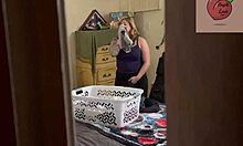 Stepmom handles the laundry chores while moaning softly.