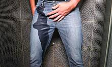 Guy wets jeans with pee then gets cumshot outdoors