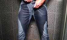 Guy wets jeans with pee then gets cumshot outdoors