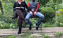 Curvy step mother satisfies step son outdoors, flashing her hairy pussy in pantyhose while giving handjob.