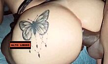 in a homemade brazilian setting, an amateur interracial couple engages in intense doggystyle assfucking with tattoos visible and bent over positions