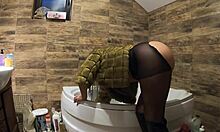 Milfy Calla indulges in pee play in the bathtub wearing fur coat and pantyhose