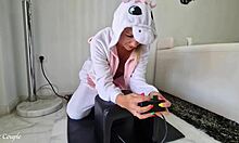 Blonde milf in unicorn costume rides sybian vibrator intensely, squirting hard.