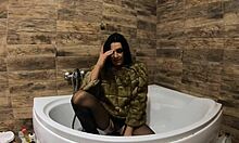 Milfy Calla indulges in pee play in the bathtub wearing fur coat and pantyhose