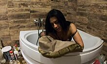 Milfy Calla indulges in pee play in the bathtub wearing fur coat and pantyhose