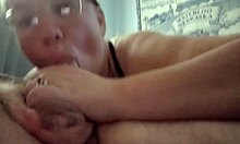 Amateur with piercings gives sloppy blowjob to fat guy
