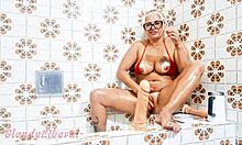 milf inserts dildo in bathroom solo