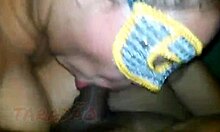 She's deepthroating that huge cock, swallowing it all