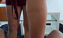 In the living room, my stepmother sucks my dick and licks my balls