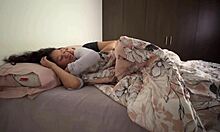 Lesbians snuggle in bed, touching asses passionately