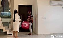 Delivery guy delivers package. He interacts with brunette alone at home.