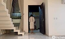 Delivery guy delivers package. He interacts with brunette alone at home.