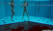 Hot Russian girls enjoy a relaxing swim in the pool