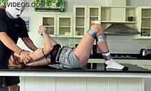 bound and teased on the countertop, moaning with pleasure