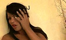 Foxy brunette tranny babe tugging on her hard cock