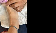 The young latina chats with her followers while displaying her bare feet