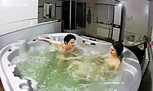 A young lesbian couple relaxes in the bath, their fingers exploring each other's wet pussies intimately.