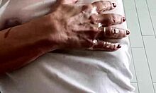 Mature Brunette Uses Baby Oil for Wet T-Shirt Striptease and Masturbation