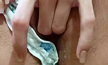 Young babe touches her pussy while masturbating alone