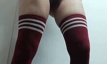 Cheeky change room babe tries on tops topless and nude in thigh high socks without panties